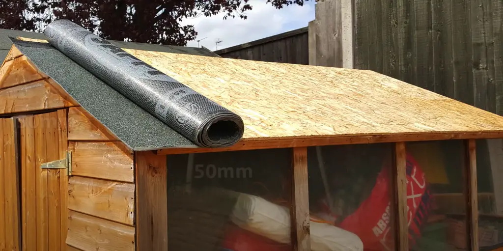 roll shed felt onto roof 